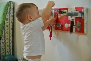 how to put busyboard safely for toddler